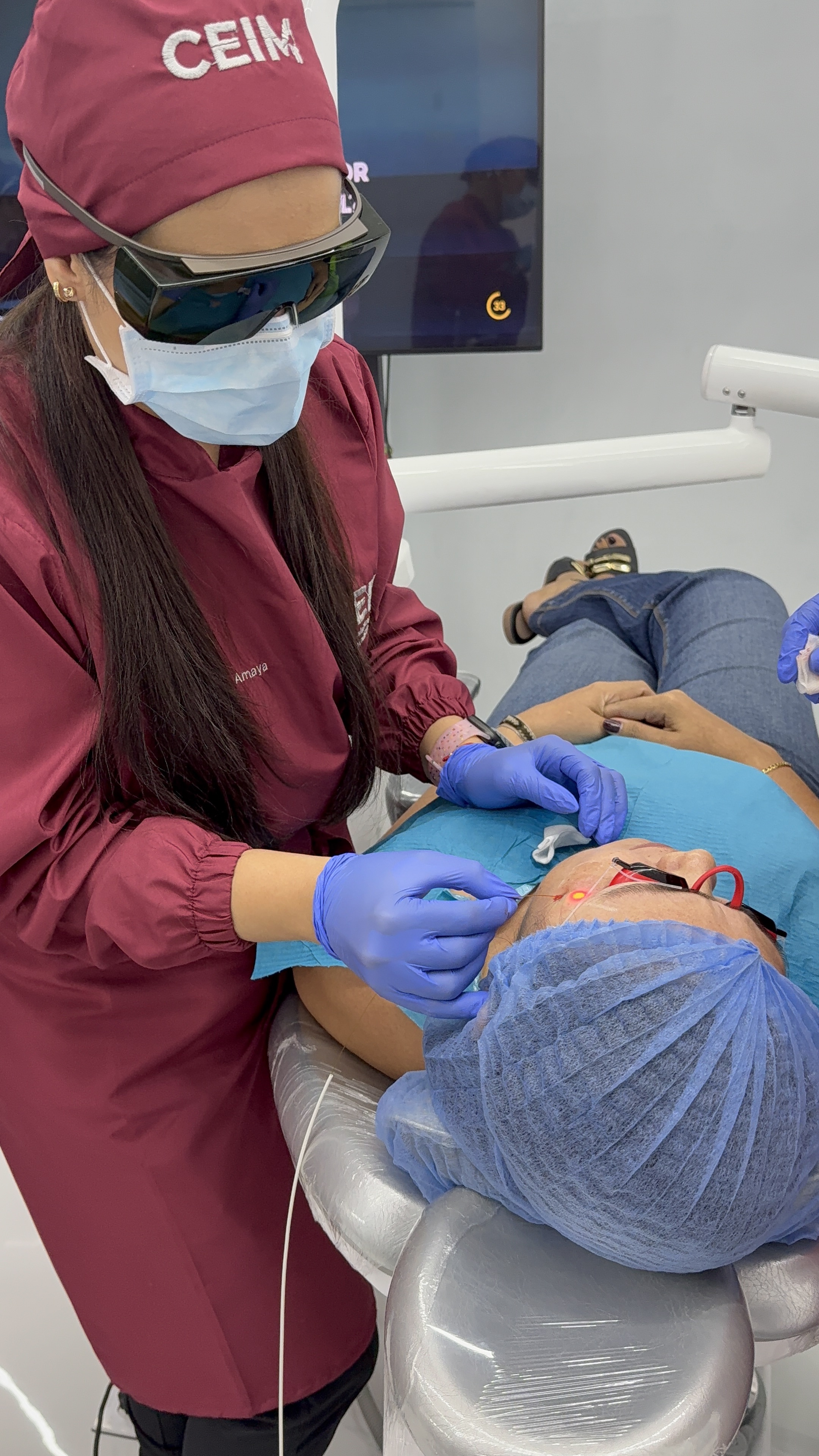 Estefania performing a laser treatment consultation